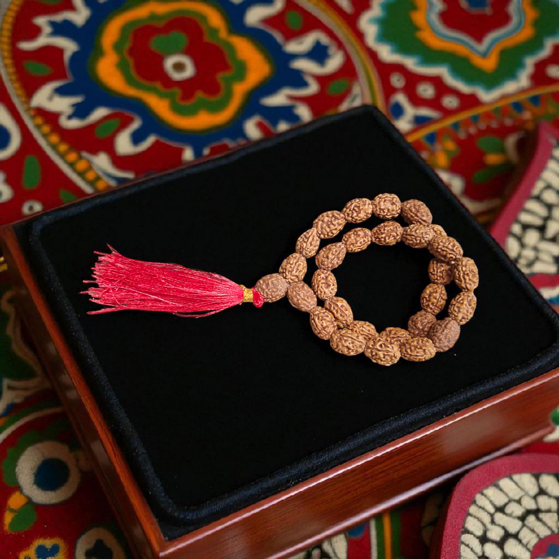 Lab-certified 3 Mukhi Rudraksha Mala for stress and anxiety relief, available in 27+1 and 108+1 bead variants, by Gurupujan
