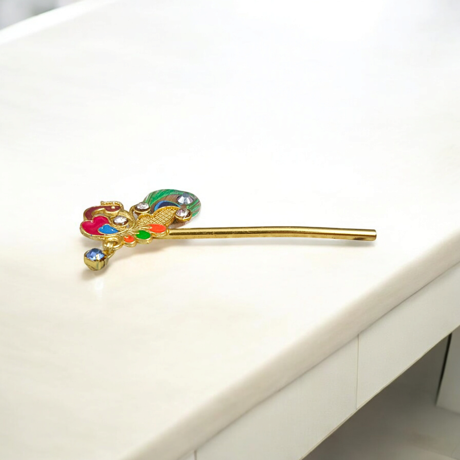 Laddu Gopal Bansuri with a peacock design and zircon embellishments, ideal for festival celebrations like Janmashtami.
