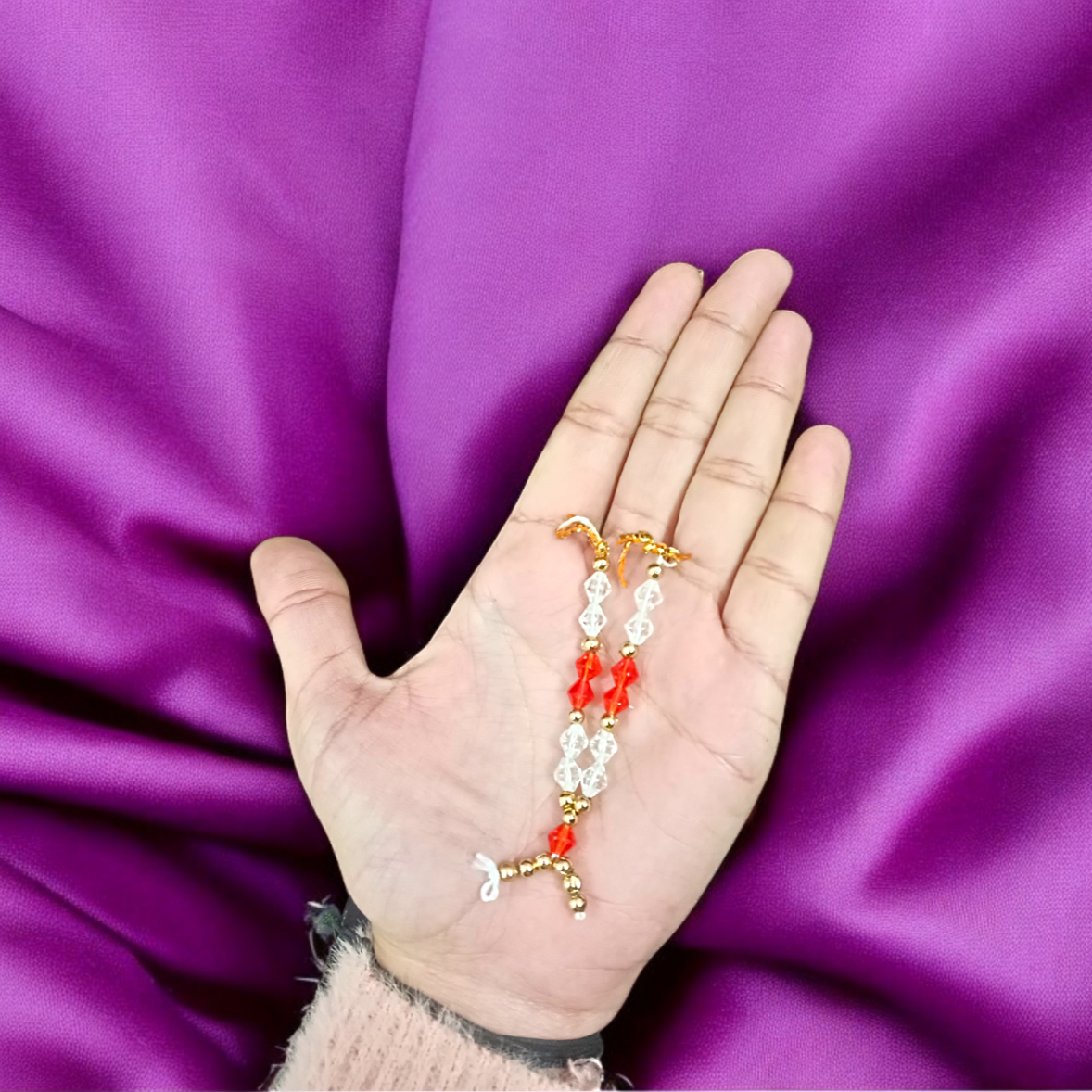 Laddu Gopal Mala made from zircon stones, designed as a small, adjustable garland for adorning Krishna idols and other deity figures, adding divine sparkle and elegance.