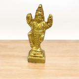 Lord Vishnu Brass Idol standing on a lotus, showcasing intricate details and a divine aura of protection and peace.