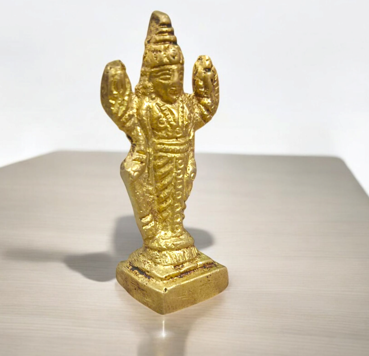 Lord Vishnu Brass Idol standing on a lotus, showcasing intricate details and a divine aura of protection and peace.