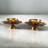Lotus-shaped Akhand Jyot set of 2 placed in a traditional temple setup, used for pooja and aarti rituals