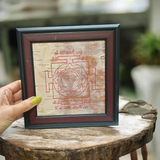 Mahakali Yantra inscribed on Bhojpatra, framed in wood, representing Maa Kali’s divine energy, strength, and protection.