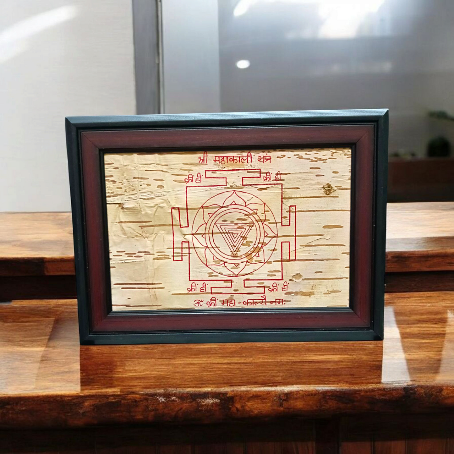 Mahakali Yantra inscribed on Bhojpatra, framed in wood, representing Maa Kali’s divine energy, strength, and protection.