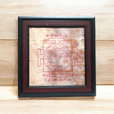 Mahakali Yantra inscribed on Bhojpatra, framed in wood, representing Maa Kali’s divine energy, strength, and protection.