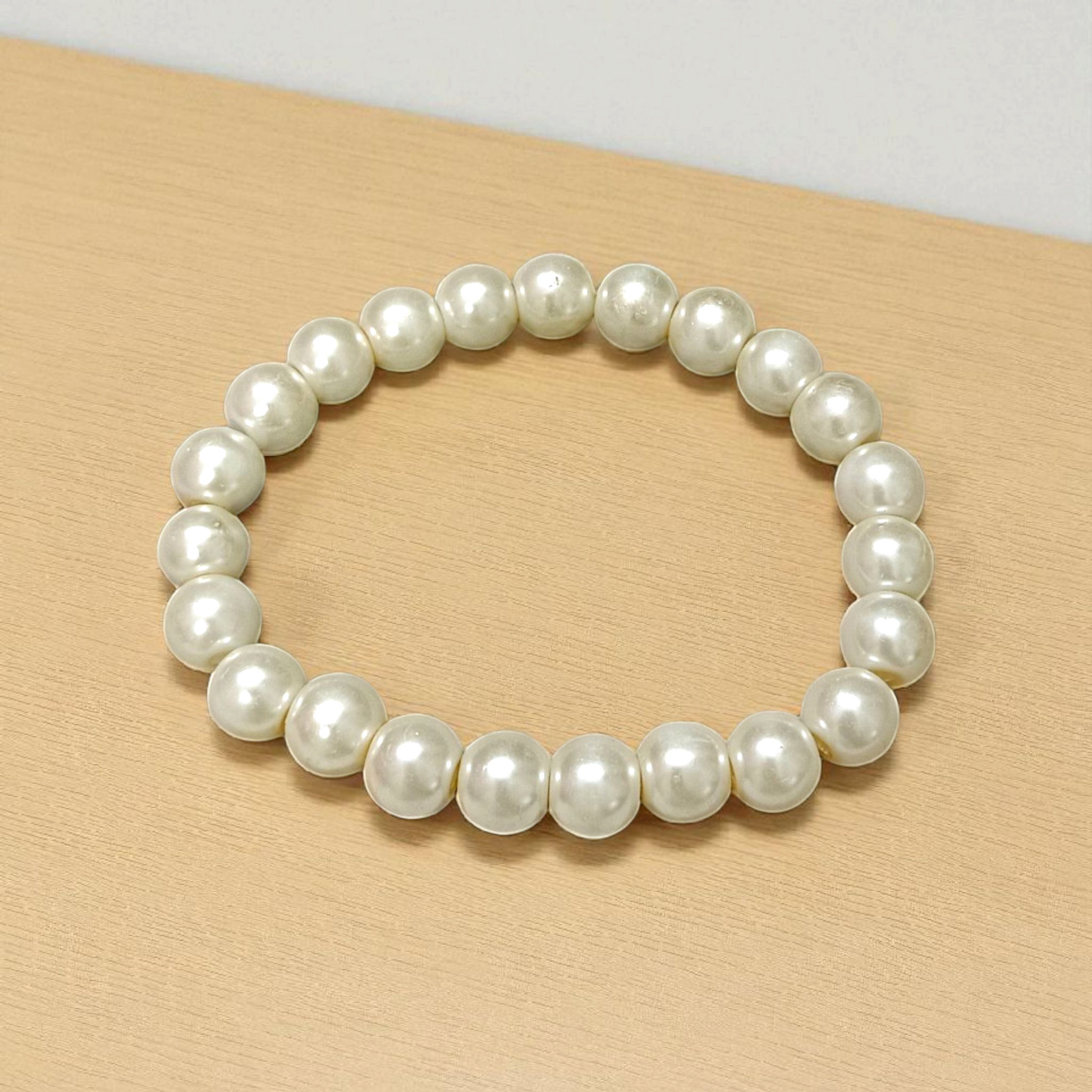 Moti Bracelet with 8MM smooth, natural pearl beads, stretchable design with certificate, promoting inner peace and emotional balance.