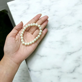 Moti Bracelet with 8MM smooth, natural pearl beads, stretchable design with certificate, promoting inner peace and emotional balance.