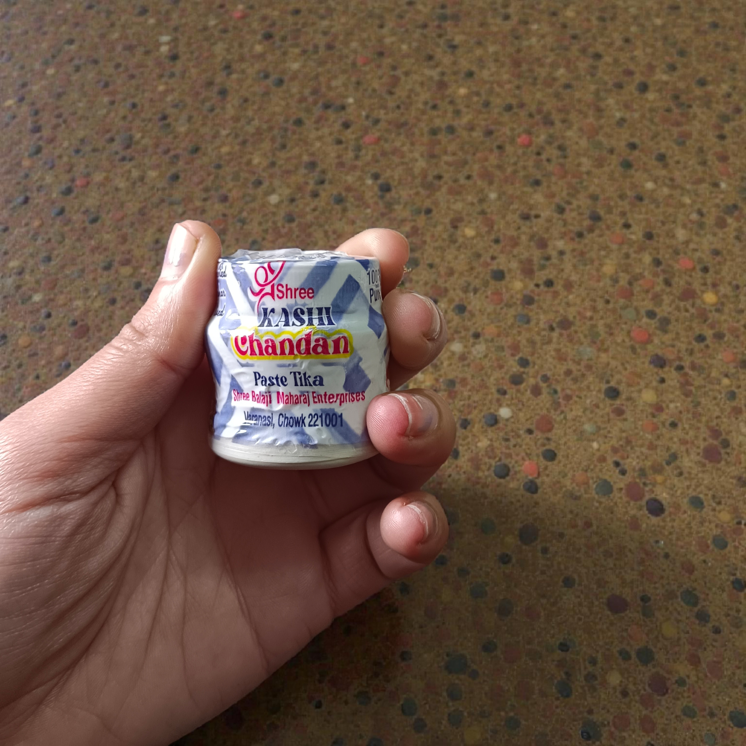 Multi-colored chandan paste tika containers in Yellow, Red, and White with keshar fragrance