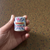 Multi-colored chandan paste tika containers in Yellow, Red, and White with keshar fragrance