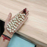 Nar Mund Mala – Traditional Skull Garland for Goddess Kali, used in Gurupujan rituals. Handcrafted mala with faux skulls symbolizing spiritual power and protection