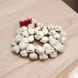 Nar Mund Mala – Traditional Skull Garland for Goddess Kali, used in Gurupujan rituals. Handcrafted mala with faux skulls symbolizing spiritual power and protection