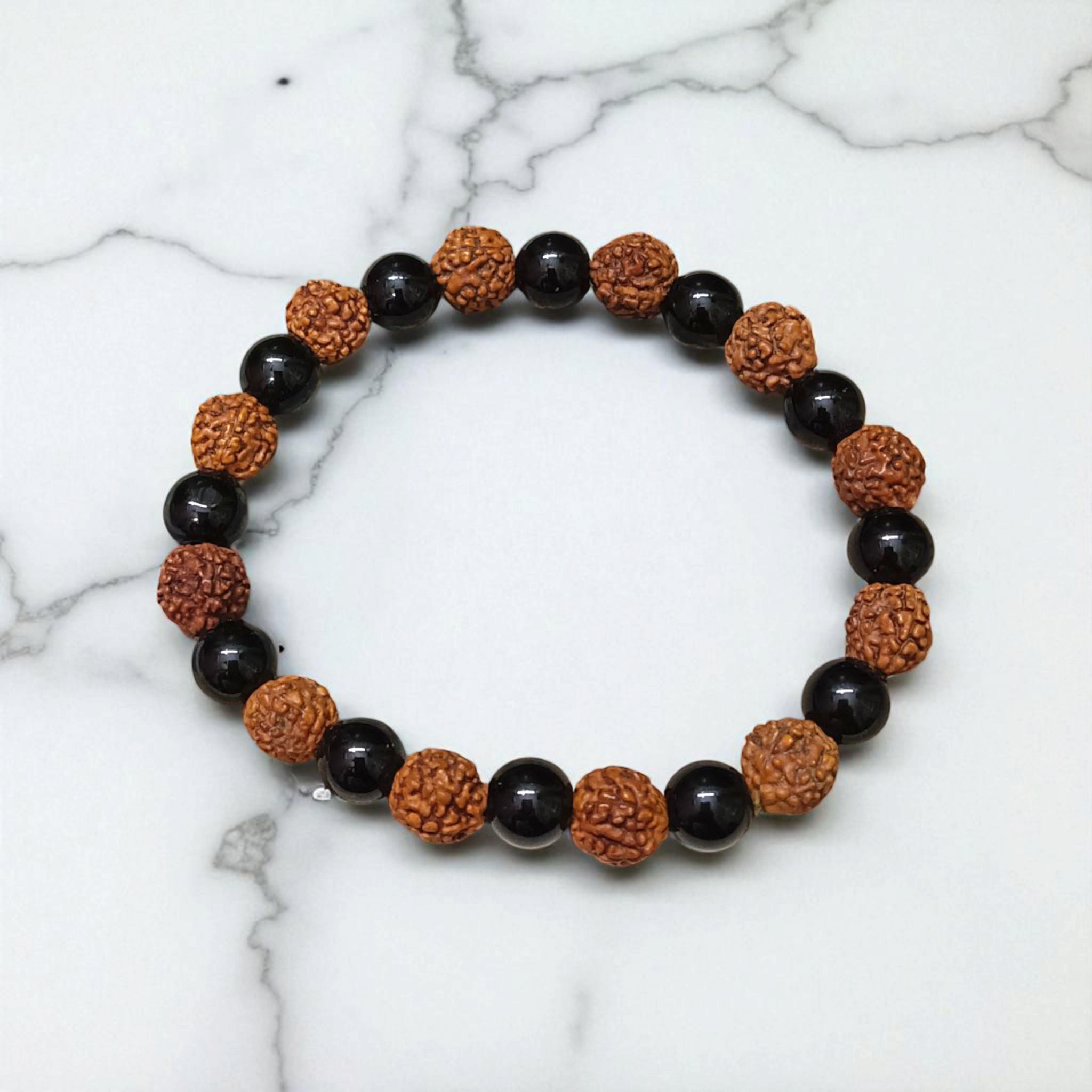 Natural Agate and 5 Mukhi Rudraksha Bracelet with 8mm black and brown beads on stretchable thread, lab certified, displayed on a natural stone background