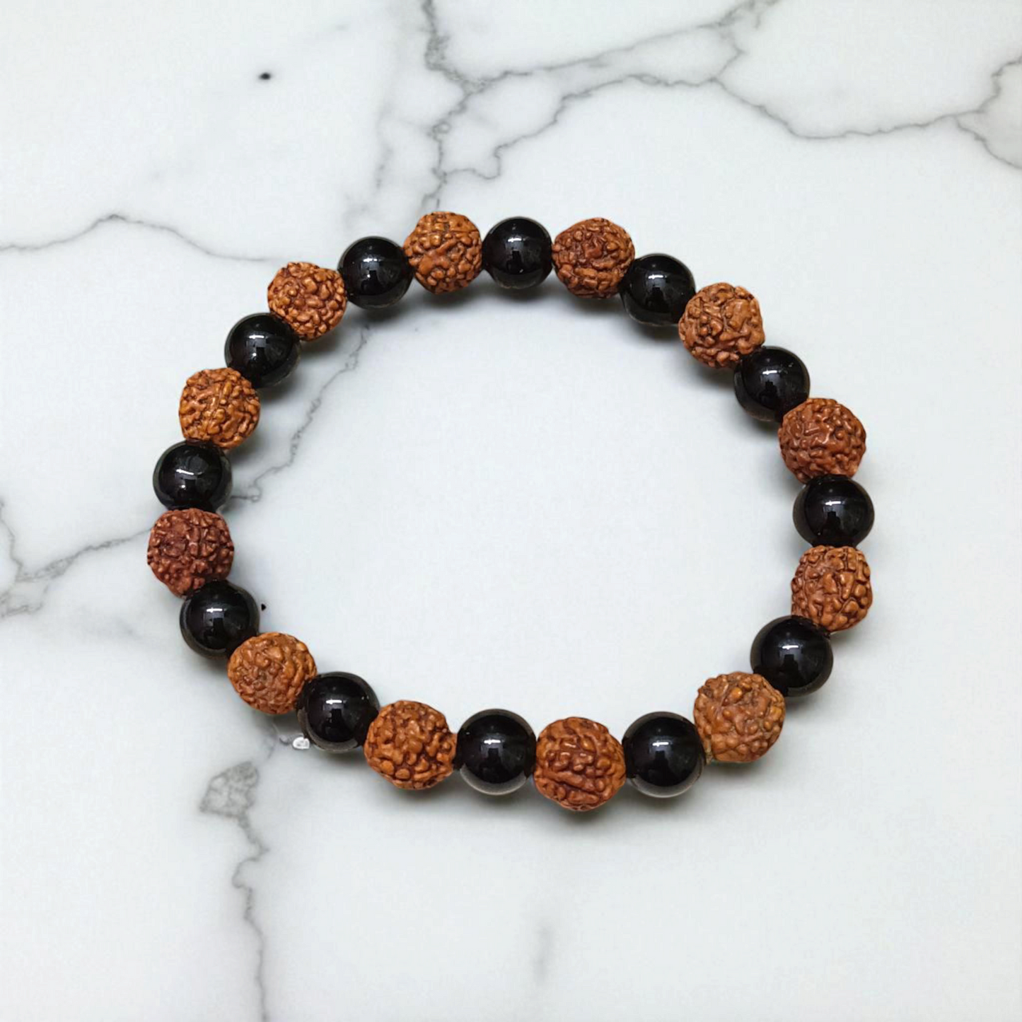Natural Agate and 5 Mukhi Rudraksha Bracelet with 8mm black and brown beads on stretchable thread, lab certified, displayed on a natural stone background