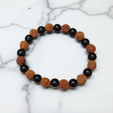 Natural Agate and 5 Mukhi Rudraksha Bracelet with 8mm black and brown beads on stretchable thread, lab certified, displayed on a natural stone background