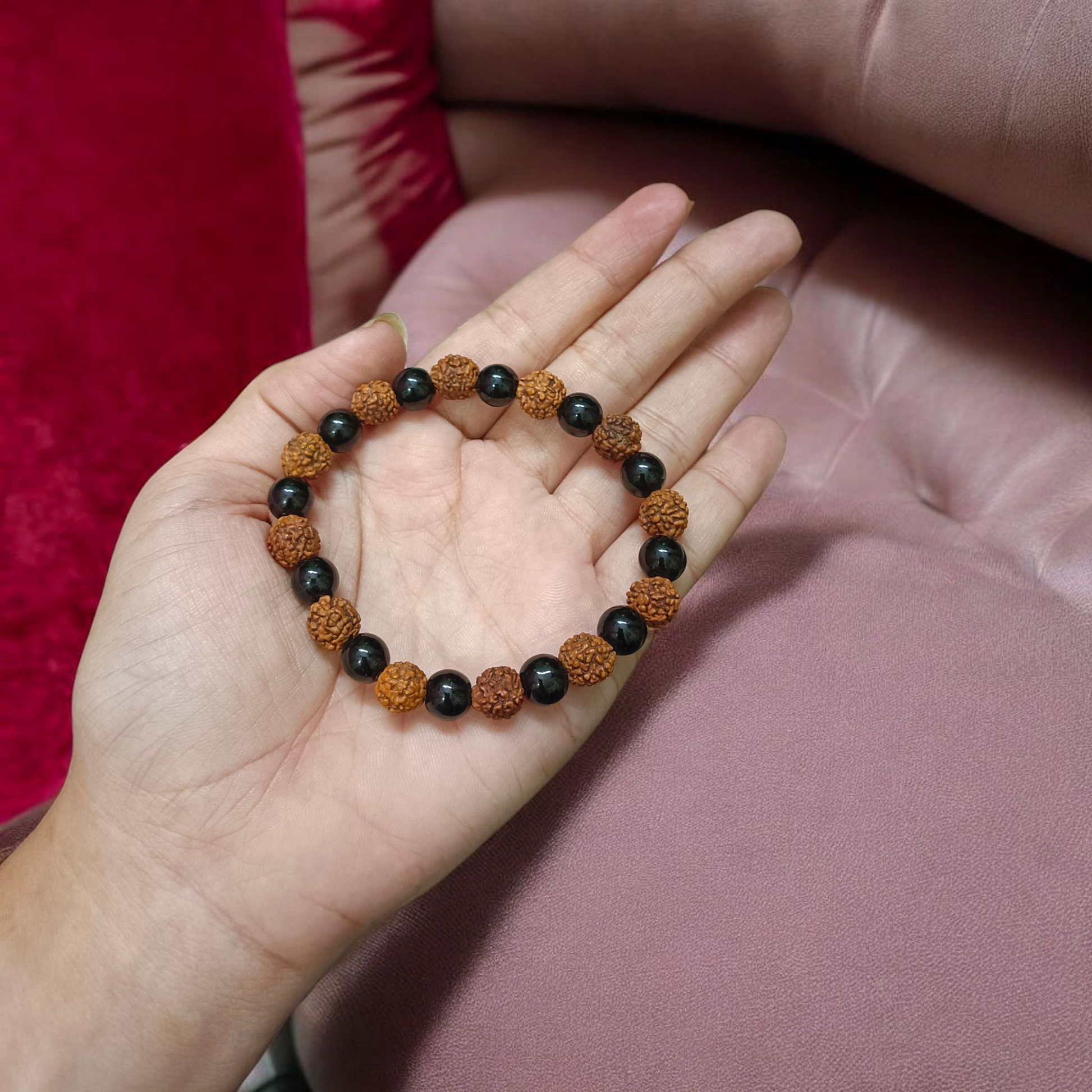 Natural Agate and 5 Mukhi Rudraksha Bracelet with 8mm black and brown beads on stretchable thread, lab certified, displayed on a natural stone background