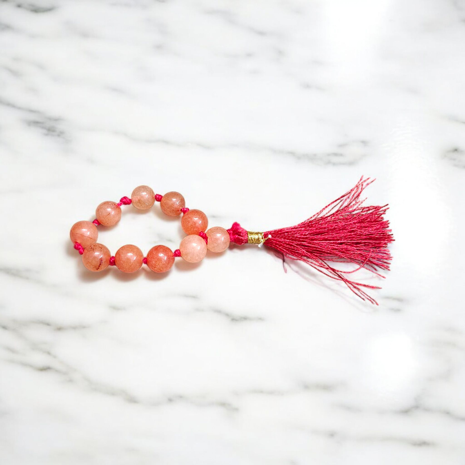 Natural Hessonite Finger Mala featuring 9+1 smooth 8mm Gomed beads, lab-certified gemstone mala for protection, clarity, and Rahu remedies
