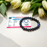 Natural Karungali (Ebony Wood) Bracelet with 8mm round beads and a central Evil Eye bead, stretchable and lab certified, displayed on a neutral background