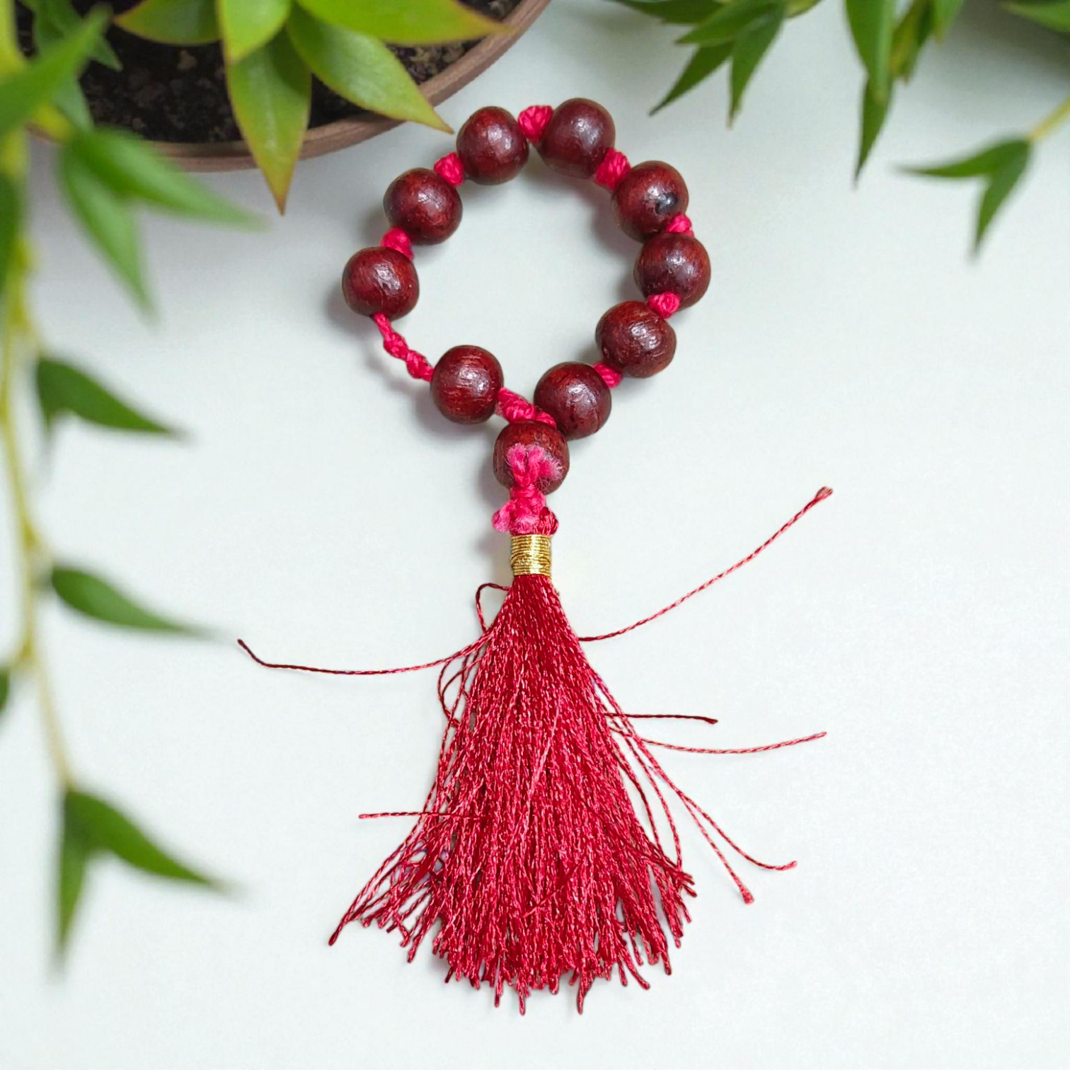 Natural Red Sandalwood Finger Mala featuring 9+1 smooth 8mm Lal Chandan beads, lab-certified mala used for meditation, prayer, and spiritual purity