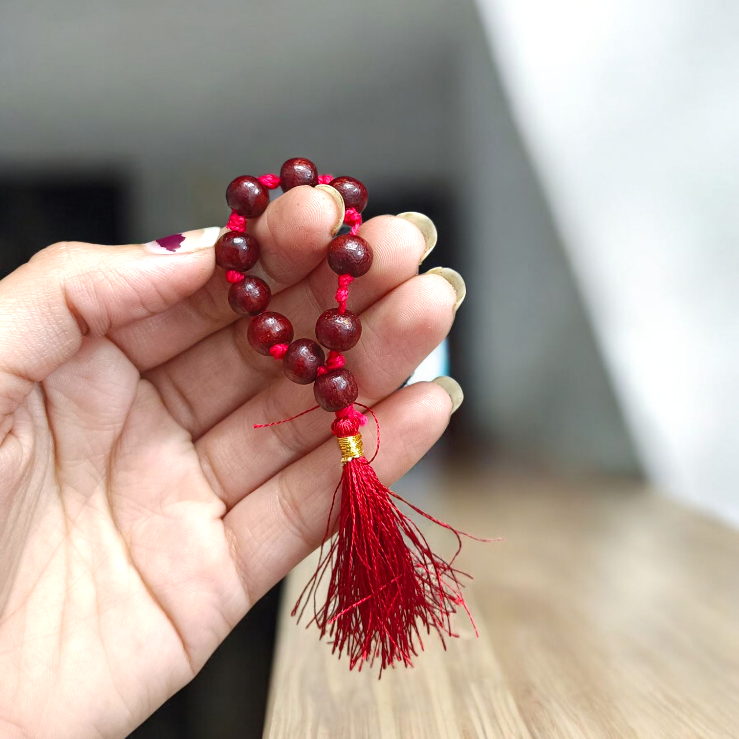 Natural Red Sandalwood Finger Mala featuring 9+1 smooth 8mm Lal Chandan beads, lab-certified mala used for meditation, prayer, and spiritual purity