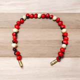 Natural Red and White Gunja seed bracelet with approx. 5mm beads, stretchable and lab certified, displayed on a white background