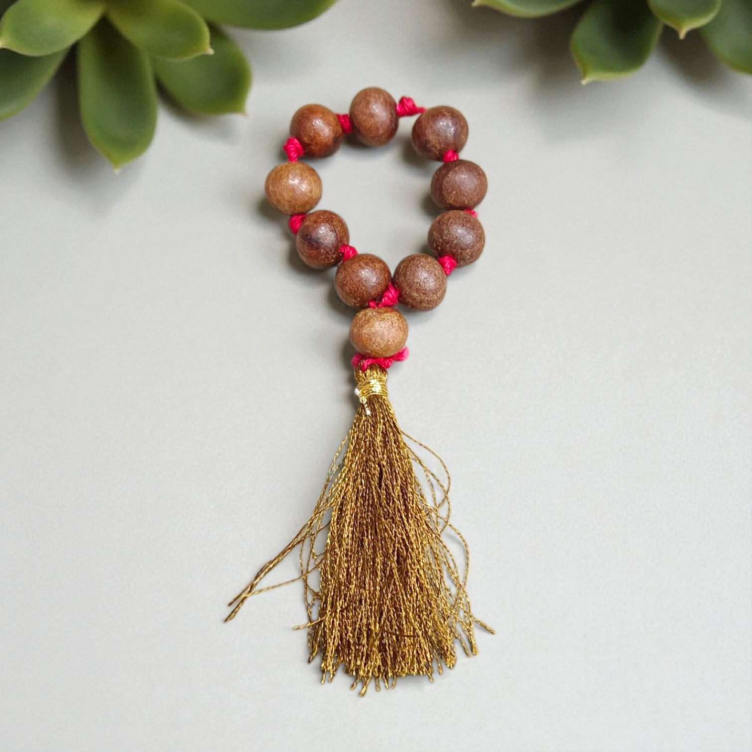 Natural Sandalwood Finger Mala featuring 9+1 smooth 8mm Chandan beads, lab-certified mala used for meditation, prayer, and spiritual energy