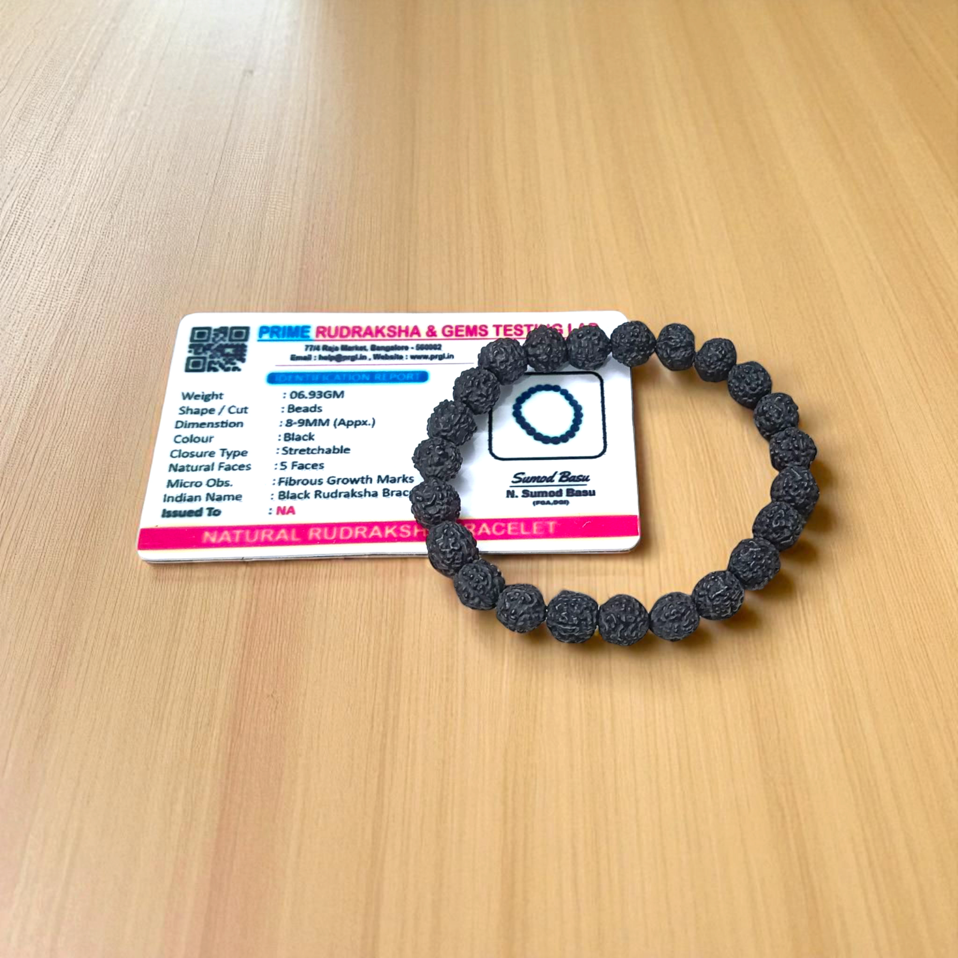 Natural black Rudraksha bracelet made with 8mm lab-certified beads, stretchable design displayed on a clean white surface