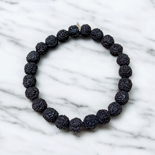 Natural black Rudraksha bracelet made with 8mm lab-certified beads, stretchable design displayed on a clean white surface