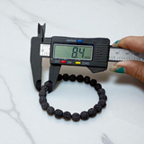 Natural black Rudraksha bracelet made with 8mm lab-certified beads, stretchable design displayed on a clean white surface