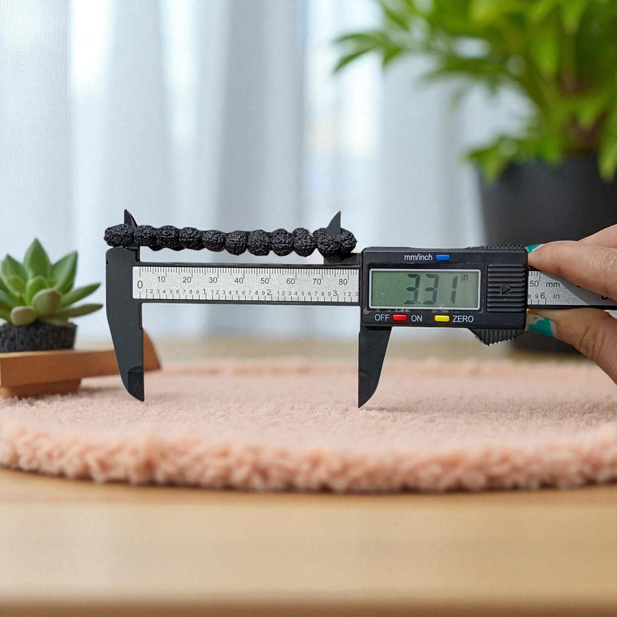 Natural black Rudraksha bracelet made with 8mm lab-certified beads, stretchable design displayed on a clean white surface