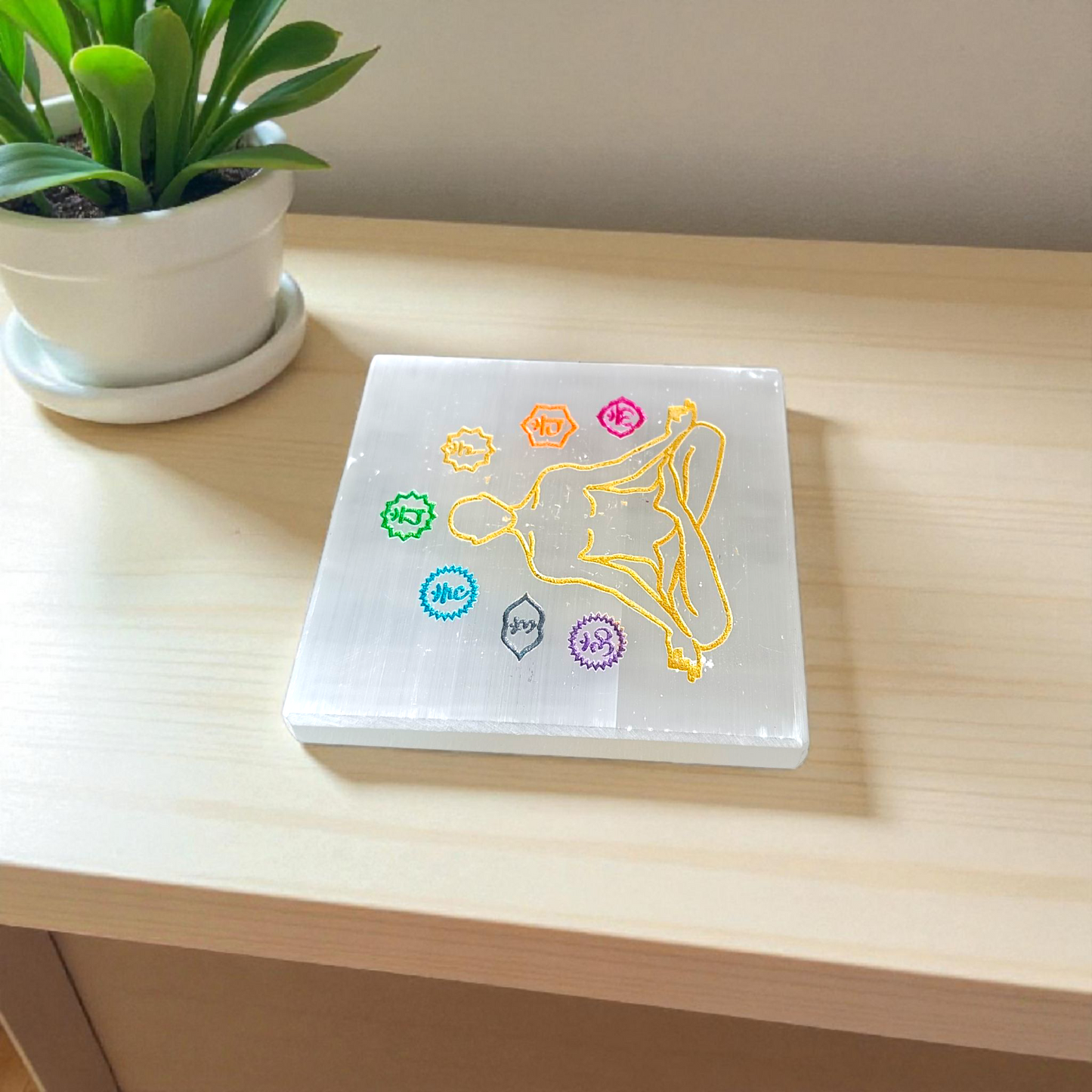 Natural lab-certified selenite charging plate with engraved 7 chakra symbols for crystal cleansing, meditation, reiki, and pooja rituals