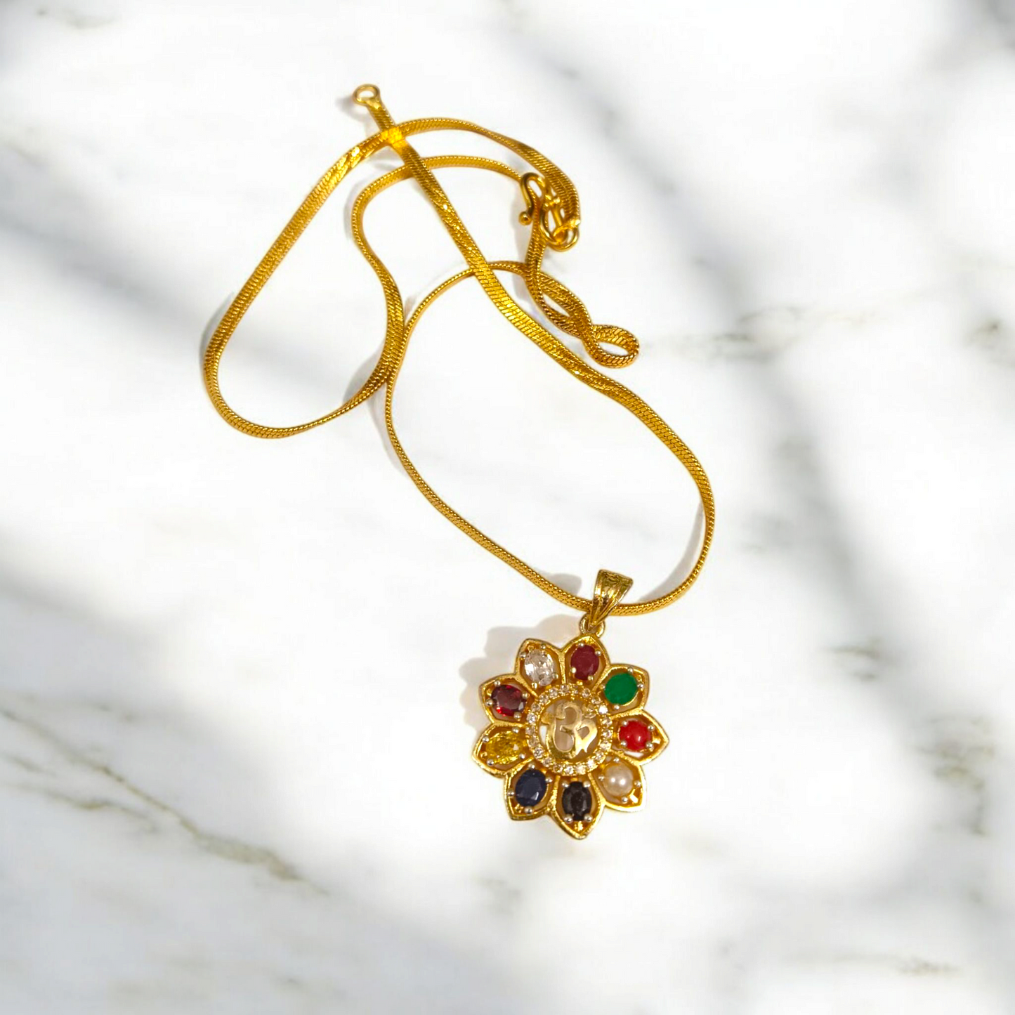 Navratan Locket | Navratan Pendant with Om Symbol and Free Gold Chain – A spiritual pendant with nine gemstones for balance, prosperity, and divine protection