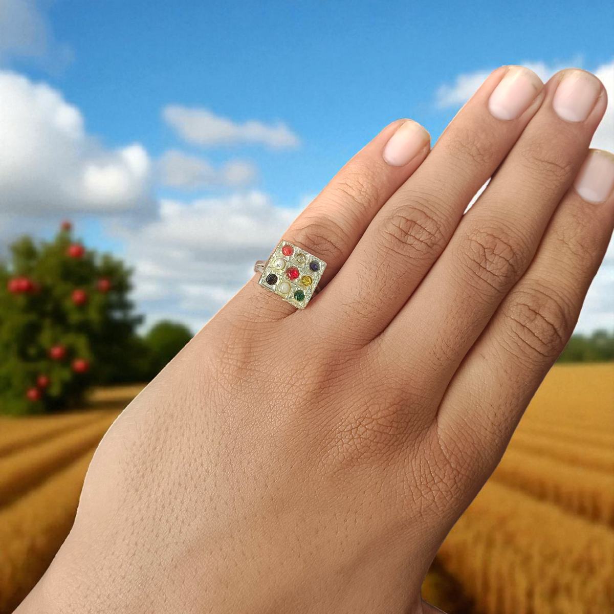 Navratan Ring Square Shape – Spiritual and astrological ring featuring nine gemstones for prosperity, health, and protection.
