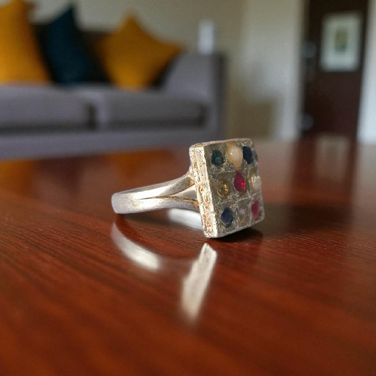 Navratan Ring Square Shape – Spiritual and astrological ring featuring nine gemstones for prosperity, health, and protection.