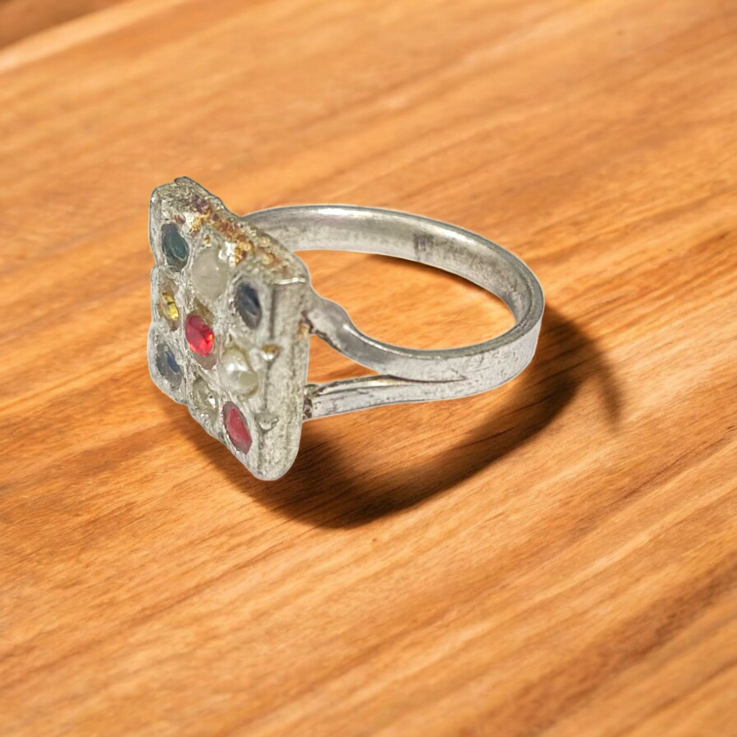 Navratan Ring Square Shape – Spiritual and astrological ring featuring nine gemstones for prosperity, health, and protection.