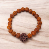 Original 5 Face Rudraksha Bracelet made with AAA Grade handpicked beads, stretchable and lab certified, placed on a rustic wooden surface