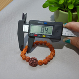 Original 5 Face Rudraksha Bracelet made with AAA Grade handpicked beads, stretchable and lab certified, placed on a rustic wooden surface