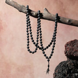 Original Lava Mala made of pure black lava beads for meditation and career stability – available in 27+1 and 108+1 bead variants.