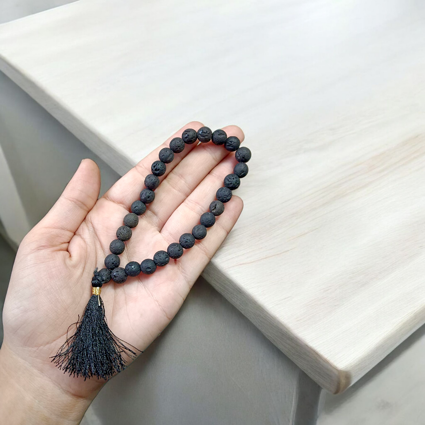 Original Lava Mala made of pure black lava beads for meditation and career stability – available in 27+1 and 108+1 bead variants