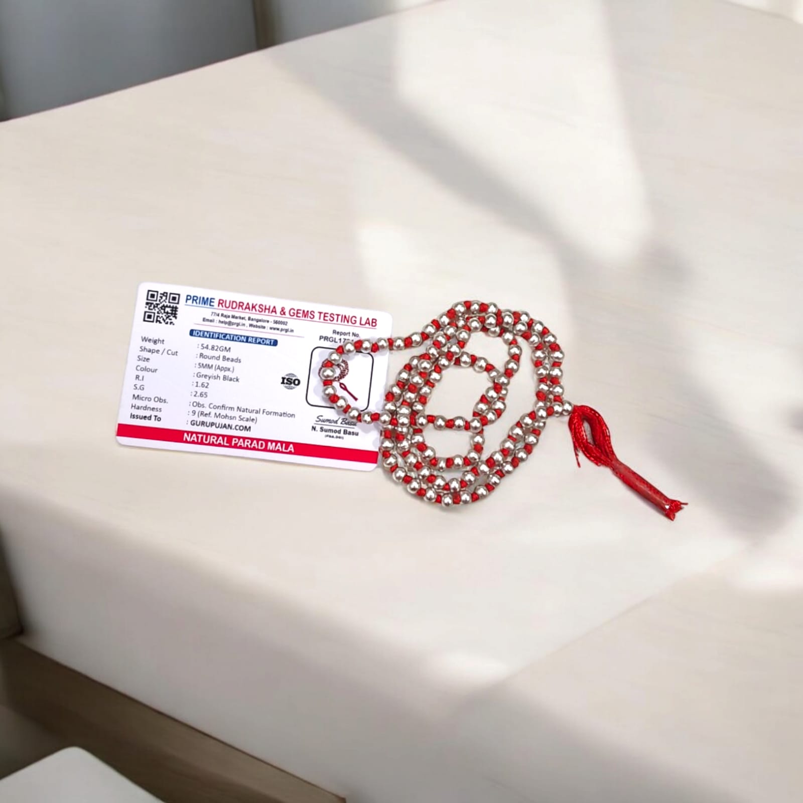 Original Parad Mala made with pure mercury beads, available in 27+1, 54+1, and 108+1 variants, offered by Gurupujan with lab certification and free gifts.