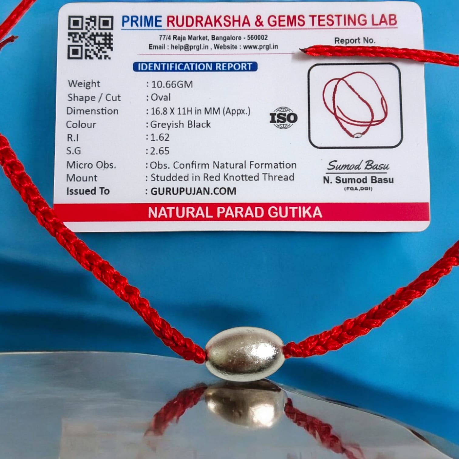 Parad Gutika locket crafted from pure mercury, featuring Lord Shiva’s image, with a red knotted thread for easy wear.