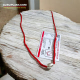 Parad Gutika locket crafted from pure mercury, featuring Lord Shiva’s image, with a red knotted thread for easy wear.