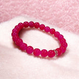 Pink Agate Bracelet with 8MM natural beads, lab certified, stretchable design, promoting emotional healing and harmony.