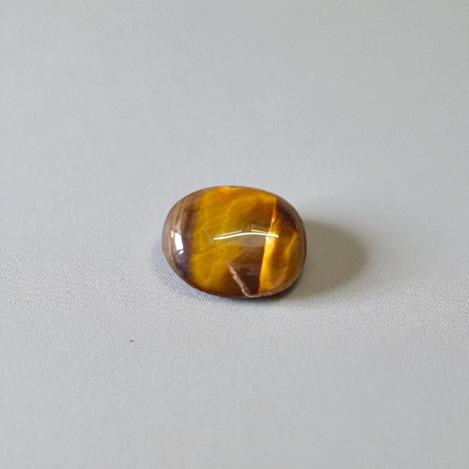 Polished Original Tiger Eye Stone&nbsp; with natural brown and golden bands, used for confidence, willpower, and meditation