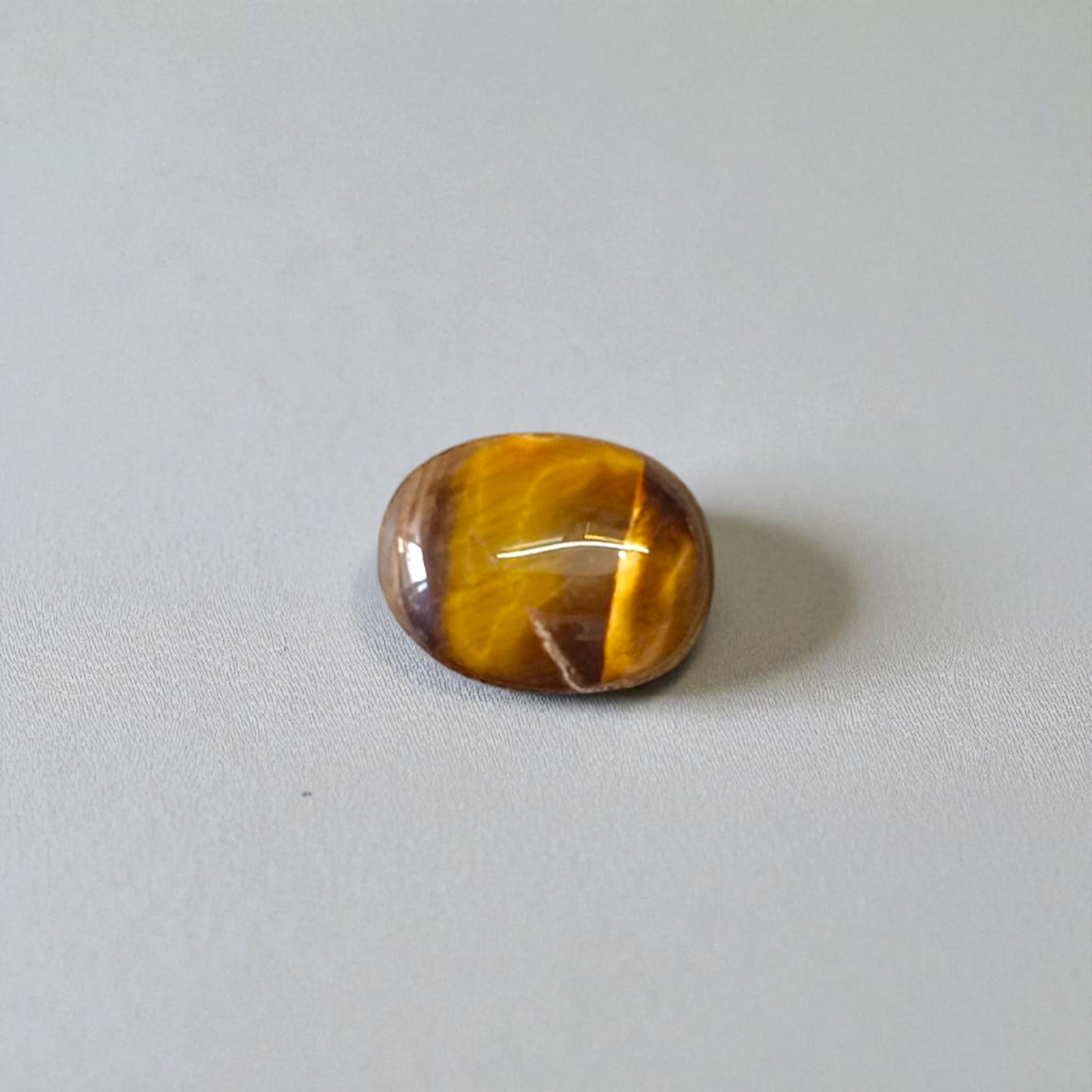 Polished Original Tiger Eye Stone&nbsp; with natural brown and golden bands, used for confidence, willpower, and meditation