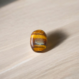 Polished Original Tiger Eye Stone&nbsp; with natural brown and golden bands, used for confidence, willpower, and meditation