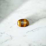 Polished Original Tiger Eye Stone&nbsp; with natural brown and golden bands, used for confidence, willpower, and meditation