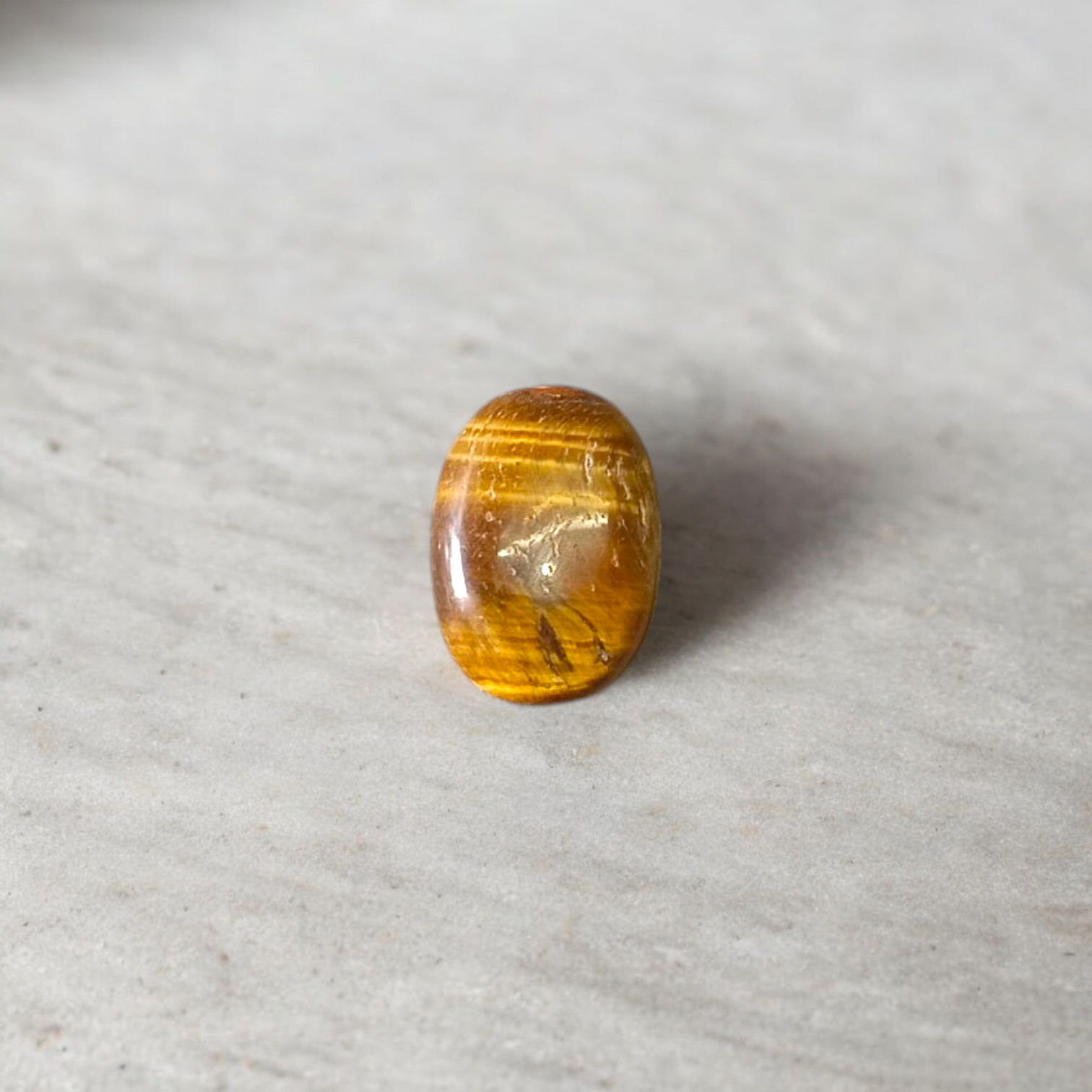 Polished Original Tiger Eye Stone&nbsp; with natural brown and golden bands, used for confidence, willpower, and meditation