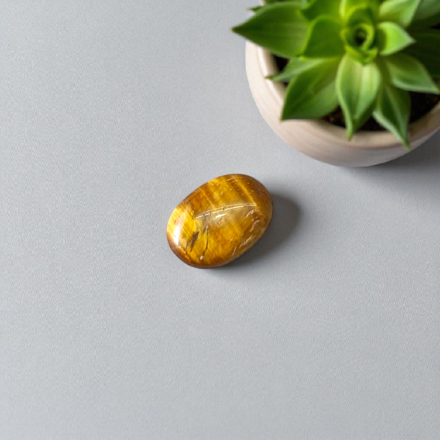 Polished Original Tiger Eye Stone&nbsp; with natural brown and golden bands, used for confidence, willpower, and meditation