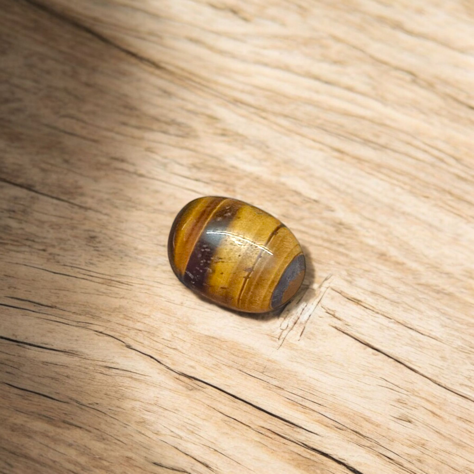Polished Original Tiger Eye Stone&nbsp; with natural brown and golden bands, used for confidence, willpower, and meditation