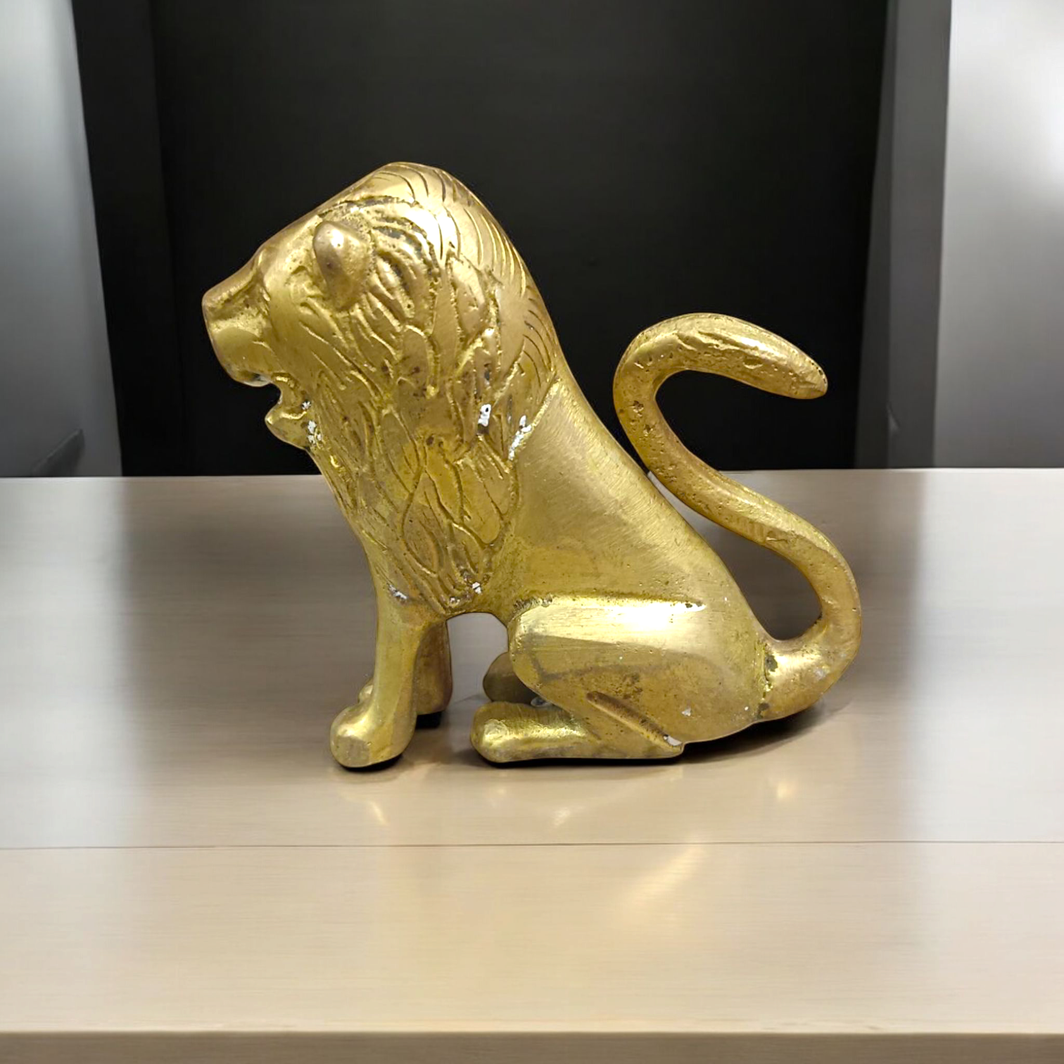 Pure Brass Lion Idol designed for table and temple decor, symbolizing strength, courage, and protection."
